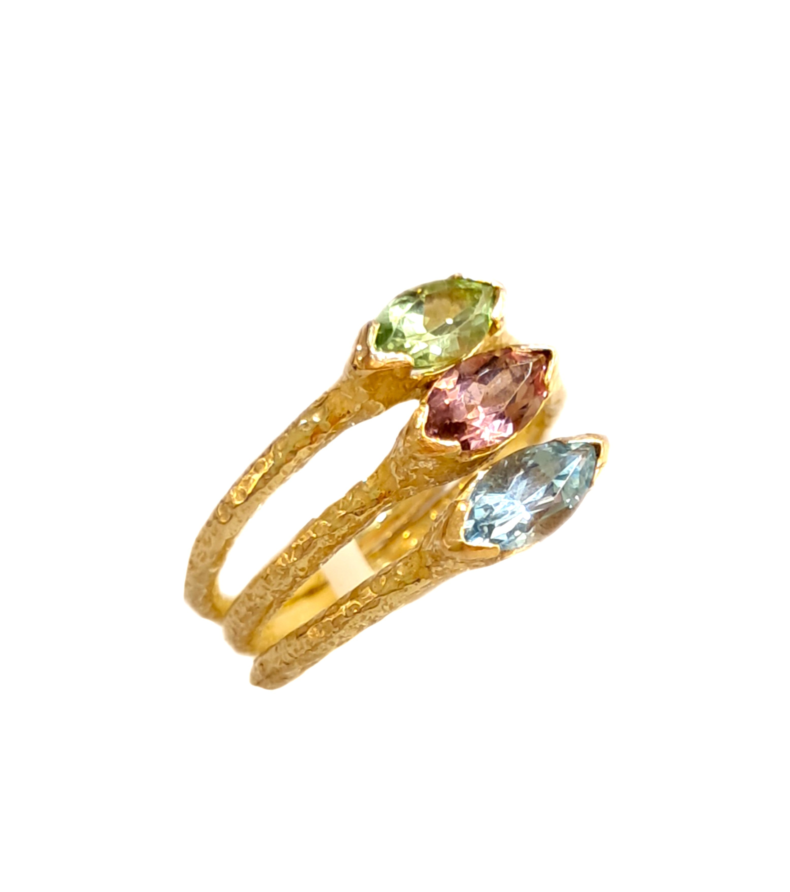Tris Anelli oro 18 kt con  peridoto tormalina acquamarina