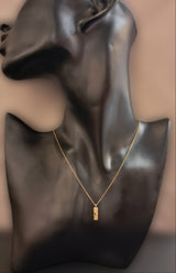Gold necklace with central element and diamond
